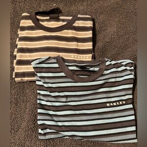 Two Oakley Men’s striped T-Shirts.